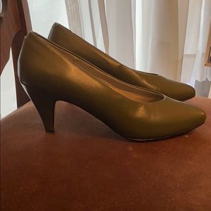 A pair of olive shoes size 8M